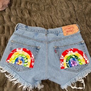 Levi's Light Blue Denim Cutoff Shorts with Rainbow Pocket Appliqués